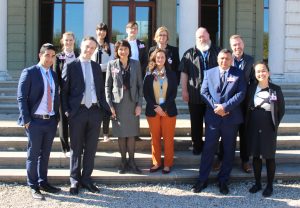 NGO delegation members stand outside Palais Wilson, Geneva